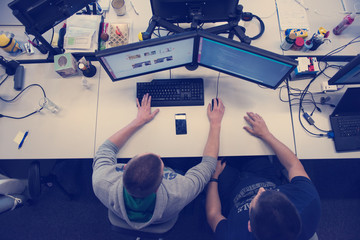 Wall Mural - young programmers writing programming code top view