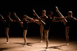© nagaets - A choreographed dance of a group of graceful pretty young ballerinas practicing on stage in a classical ballet school
