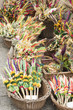 Baskets with traditional colourful Easter palms for sale at the 2018 Annual Easter Market, Main Square, Krakow, Poland