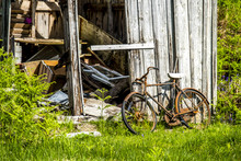 Abandoned Shed In The Scottish Highlands With A Broken Rusted Bike Outside