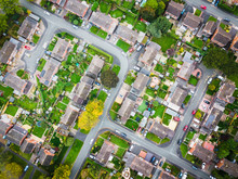 Satellite Image Style Aerial View Of Homes On An English Housing Estate. Looking Straight Down On Streets And Houses With Community And Social Concepts