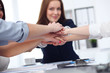 © rogerphoto - Close Up of unknown business people joining hands. Teamwork, cooperation and success concept of people communication