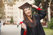 © Prostock-studio - Happy young woman on her graduation day.