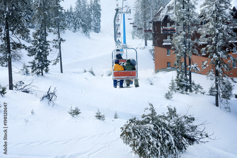 Ski lift at mountain resort. Winter vacation