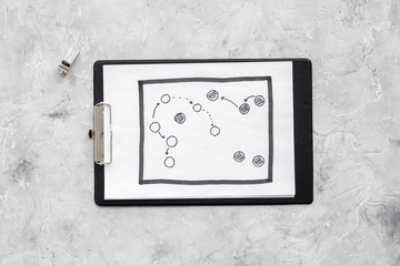 Sticker - Sport coach concept. Pad with tactic plan of the match near whistle stone background top view copy space