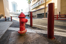 Red Classic USA Fire Hydrant With Protection On City Street