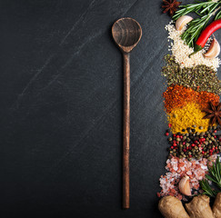 Different kind of spices on a black background