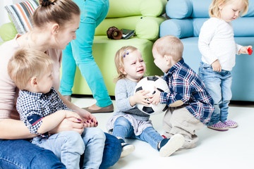 Children with foot ball indoor