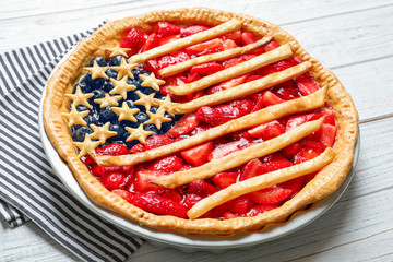 Wall Mural - Tasty American flag pie on wooden table