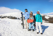 © Africa Studio - Group of snowboarders on ski piste at snowy resort. Winter vacation
