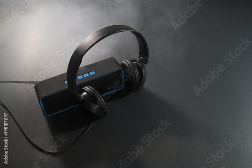 Fotografía Music concept. Speaker and headphones isolated