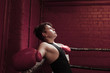 © Igor Emmerich - Young boxer taking a break on the ring during training to get his breath back