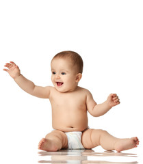 Wall Mural - 8 month infant child baby boy kid toddler sitting in diaper thinking happy laughing isolated on a white