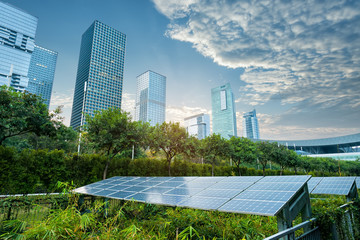 Wall Mural - solar panel plant with urban landscape landmarks,ecological energy renewable concept.