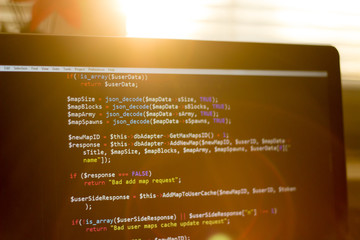 php back-end code in sunset rays. computer programming source code. abstract screen of web developer