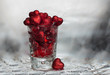 Sweaty wine glass full of red hearts