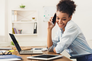 Business talk, woman consulting by phone at office