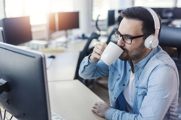 Wall Mural - Programmer drinking coffee