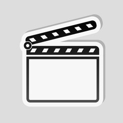 Film clap board cinema open icon. Sticker style with white border and simple shadow on gray background