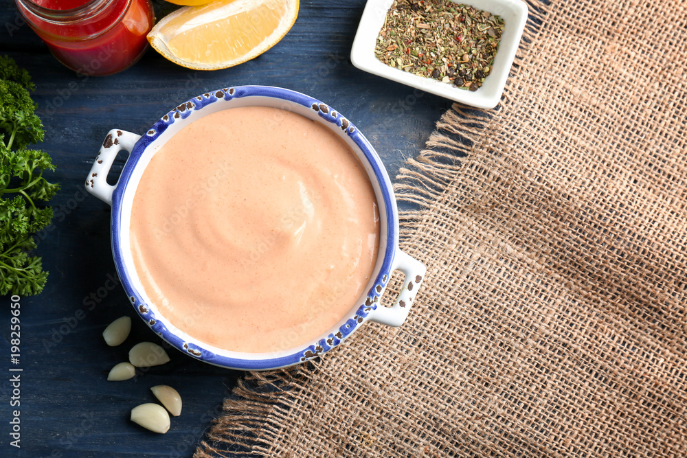 Tasty creamy sauce for fish taco in casserole on kitchen table