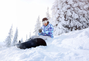 Sticker - Snowboarder on ski piste at snowy resort. Winter vacation