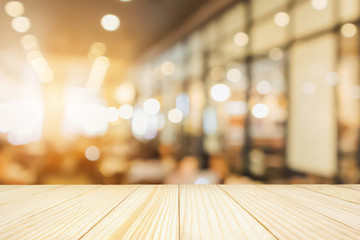 Wall Mural - Wood table with Restaurant cafe or coffee shop interior with people abstract defocused blur background