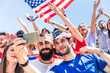 © william87 - American fans taking a selfie at stadium during a match