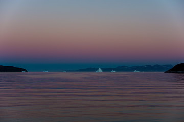 Wall Mural - before sunrise. greenland's fjord and icebergs.