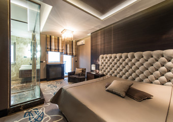 Interior of a master bedroom with luxury bathroom