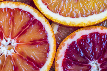 round slices of red orange, background and texture