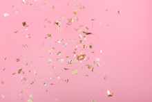 Golden Confetti On Pink Background