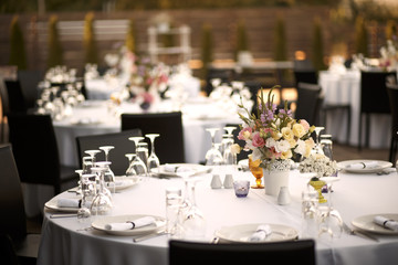 Formal dinner service at a outdoor wedding banquet