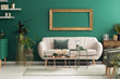 © Photographee.eu - Beige sofa in green interior
