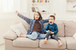 © Prostock-studio - Happy children watching TV at home