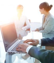 Poster - closeup of businessman typing on laptop.