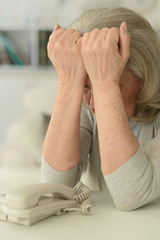 Wall Mural - upset senior woman with phone