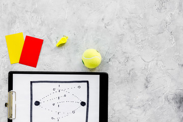 Sticker - Sport judging concept. Tennis referee. Tactic plan for game, tennis ball, red and yellow cards, whistle on stone background top view copy space