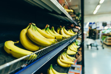 Wall Mural - yellow bananas on store shelf. fruits grocery shopping