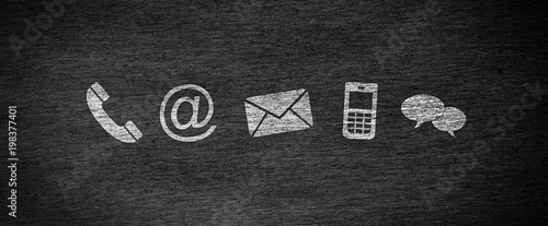 Fotografía Website and Internet contact us page concept with white icons on a blackboard