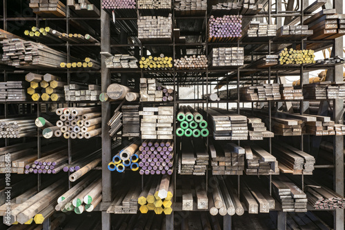 Fotomural Stacked steels in metal warehouse