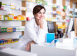 © JackF - female pharmacist demonstrating assortment of pharmacy