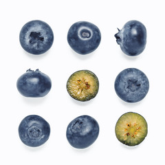 Wall Mural - Seamless pattern with blueberry. Superfood and detox abstract patterb background. Blueberries whole and cut isolated on white background. Top view