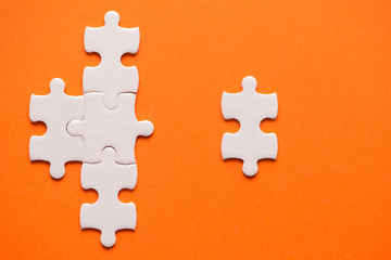 Wall Mural - White details of puzzle on orange background