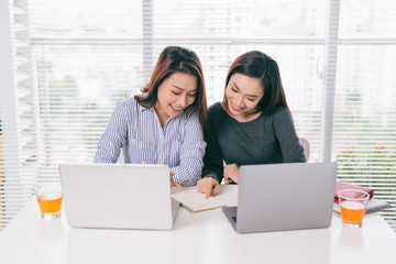 Teamwork. Businesspeople working together with laptop in office.