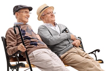 Wall Mural - Two mature men sitting on a bench