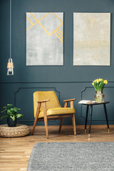 Wall Mural - Armchair between plant and table