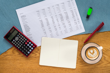 Wall Mural - template of financial accounting desk with white note pad, calculator and german statistics from abo