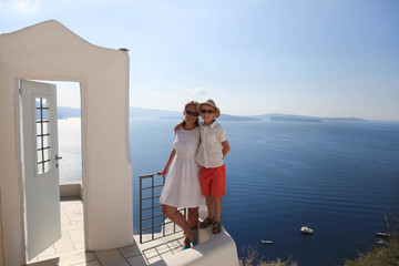 Happy family in town Oia of Santorini, Greece