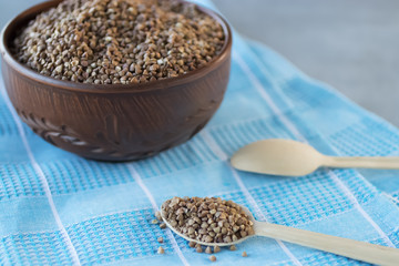 Buckwheat cereal in brown bowl.