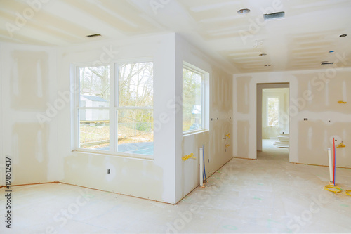 Interior construction of housing project with drywall installed and ... Interior construction of housing project with drywall installed and ...
